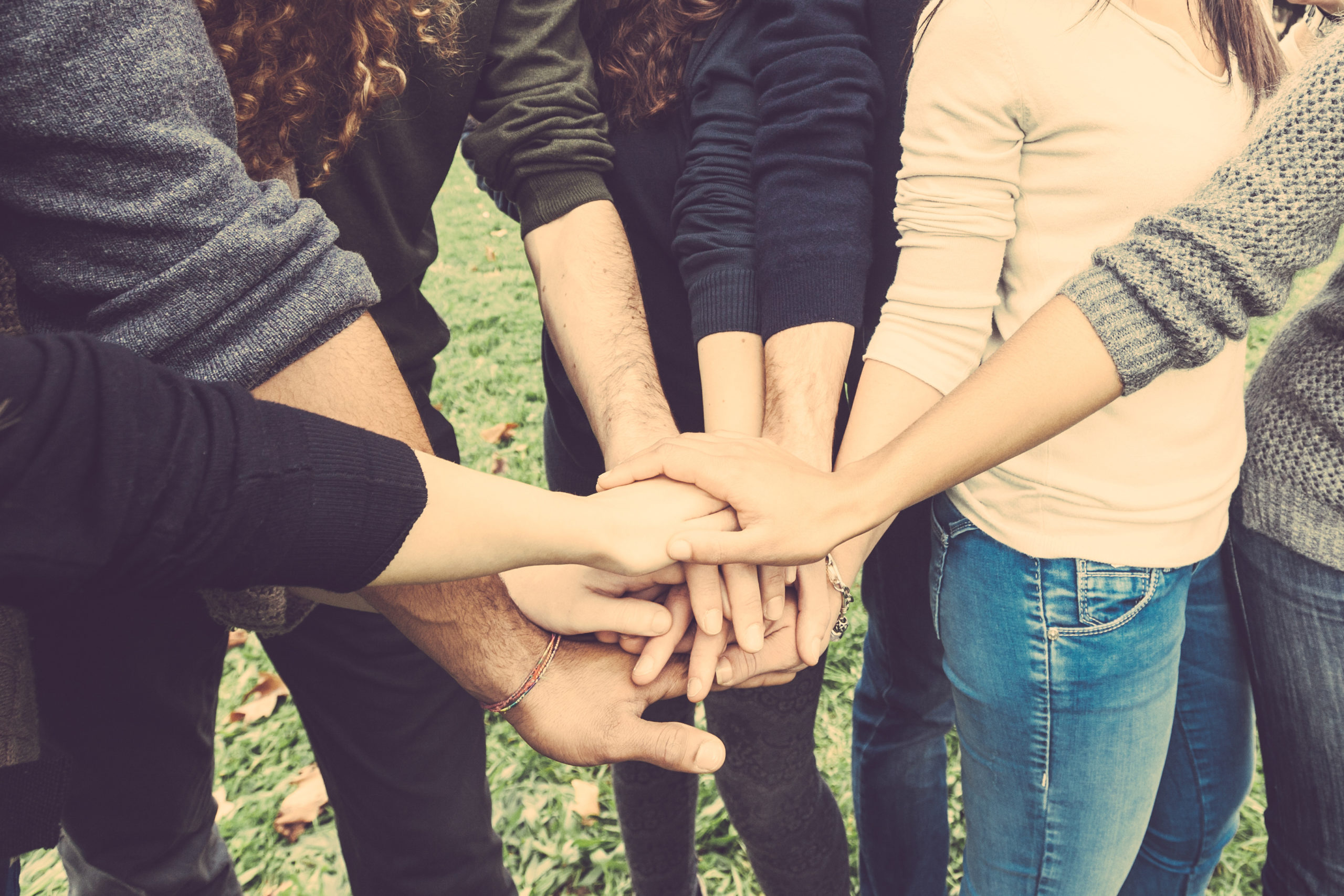 Multiracial,Group,Of,Friends,With,Hands,In,Stack,,Strong,Concept Equipo | Westeco SRL, Mayorista en Seguridad e Higiene Industrial